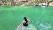 a natural cold plunge in a crystal clear stream